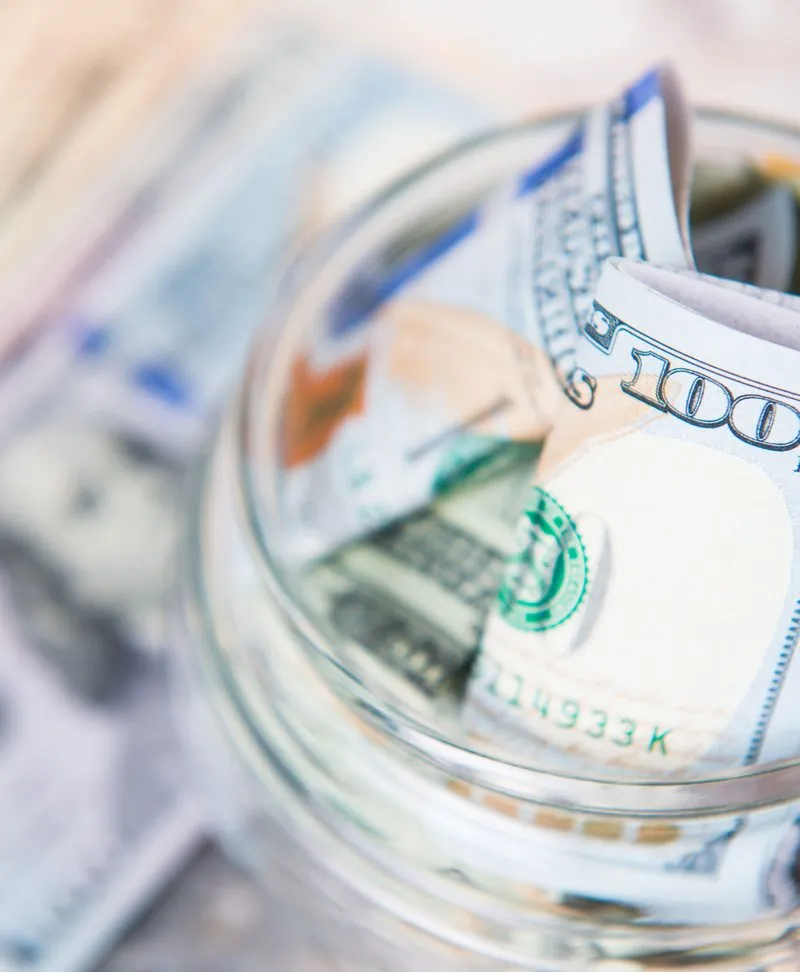 Banknotes in a glass jar